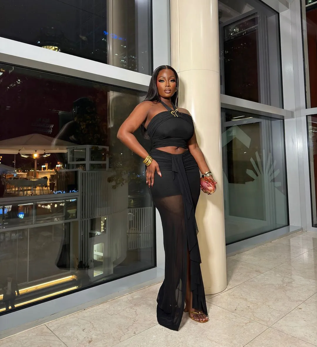 Striking Black Two-Piece Set with Sheer Skirt and Halter Top